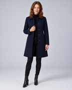 Woman wearing navy tailored longline wool-blend coat with button front and side pockets, front view