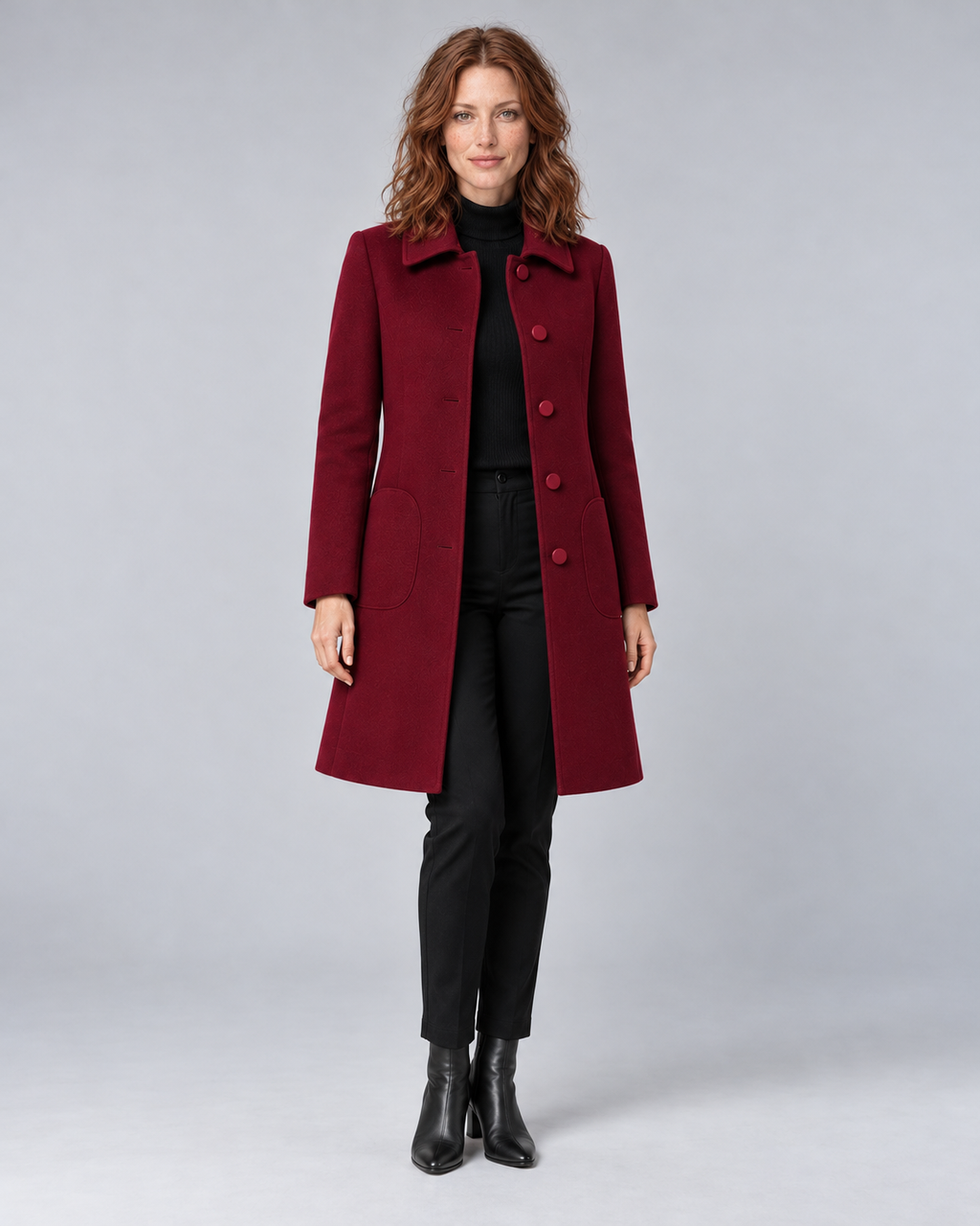 Woman wearing wine tailored longline wool-blend coat with button front and side pockets, front view