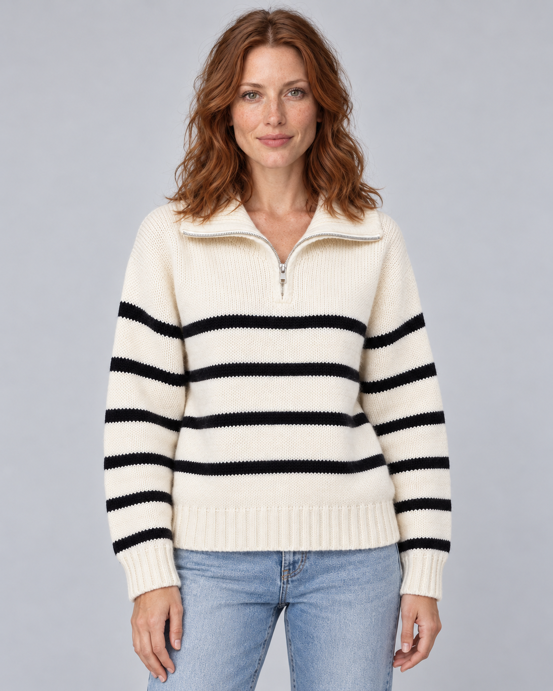 Woman wearing white striped half-zip funnel-neck jumper with long raglan sleeves, front view