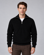 Man wearing black quarter-zip ribbed knitted sweater with stand collar, front view