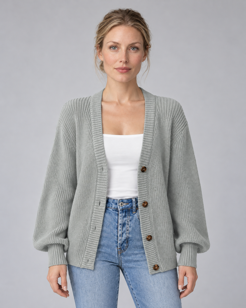 Woman wearing grey V-neck ribbed button-front cardigan with long sleeves, front view
