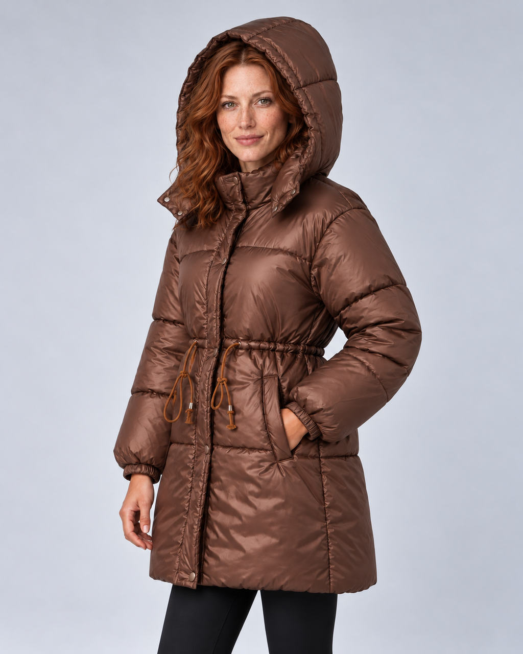 Brown glossy drawstring puffer, hood up angle view