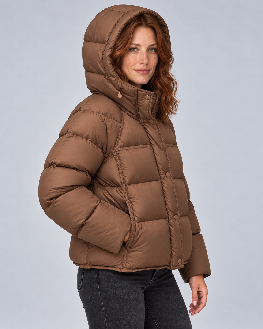 Brown high neck puffer, hood up angle view